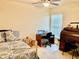 Bedroom with a queen bed, desk and vintage roll-top desk at 87 Long Meadow Ln, Rotonda West, FL 33947