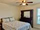 Bedroom with a queen bed, ceiling fan and built-in dresser at 87 Long Meadow Ln, Rotonda West, FL 33947