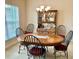 Formal dining room with an oval table, six chairs, and a wooden hutch at 87 Long Meadow Ln, Rotonda West, FL 33947