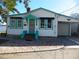 White bungalow with teal accents and water view at 9 Plaza E St, Bradenton, FL 34208