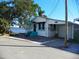 Cute bungalow with teal accents near the water at 9 Plaza E St, Bradenton, FL 34208