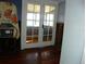 French doors leading to a sunroom with hardwood floors at 9 Plaza E St, Bradenton, FL 34208