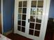 White interior doors with glass panes, leading to another room at 9 Plaza E St, Bradenton, FL 34208