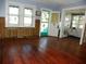 Living room with hardwood floors and view of sunroom at 9 Plaza E St, Bradenton, FL 34208