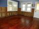 Living room with hardwood floors and exposed walls at 9 Plaza E St, Bradenton, FL 34208