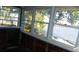 Sunroom with waterfront views and wood flooring, under renovation at 9 Plaza E St, Bradenton, FL 34208