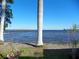 Relaxing waterfront view, featuring a pier and palm trees at 9 Plaza E St, Bradenton, FL 34208