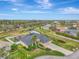 Aerial view of a house with a pool and canal views at 9100 Yarberry St, Sarasota, FL 34240