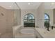 Spa-like bathroom with soaking tub and walk-in shower at 9100 Yarberry St, Sarasota, FL 34240