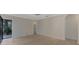 Spacious bedroom with wood-look floors and sliding glass doors at 9100 Yarberry St, Sarasota, FL 34240