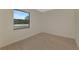 Simple bedroom with wood-look floors and a window at 9100 Yarberry St, Sarasota, FL 34240