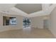 Bright living room with wood-look floors and access to pool area at 9100 Yarberry St, Sarasota, FL 34240