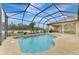 Refreshing kidney-shaped pool with screened patio at 9100 Yarberry St, Sarasota, FL 34240