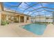 Relaxing kidney-shaped pool with a screened enclosure at 9100 Yarberry St, Sarasota, FL 34240