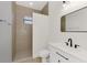 Simple bathroom with a walk-in shower, toilet and single vanity at 9100 Yarberry St, Sarasota, FL 34240