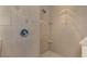 Shower stall with beige tile and built-in shelves at 9100 Yarberry St, Sarasota, FL 34240