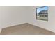 Simple bedroom with wood-look floors and window at 9100 Yarberry St, Sarasota, FL 34240