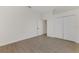 Simple bedroom with double door closet and wood-look flooring at 9100 Yarberry St, Sarasota, FL 34240