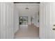 Bright and airy entryway with light wood floors and views into the living area at 9100 Yarberry St, Sarasota, FL 34240