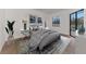 Main bedroom with grey bedding and view of the pool at 9100 Yarberry St, Sarasota, FL 34240