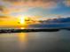 Aerial sunset view of waterfront homes at 10428 Marion St, Englewood, FL 34224