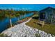 Charming backyard with waterfront access and swing at 10428 Marion St, Englewood, FL 34224