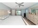 Bedroom with water views, king-size bed, and ample closet space at 10428 Marion St, Englewood, FL 34224