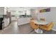 Kitchen dining area with round table and four mustard yellow chairs at 10428 Marion St, Englewood, FL 34224