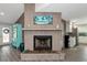 Living room fireplace with a rustic wood mantel at 10428 Marion St, Englewood, FL 34224