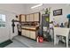 Garage workshop with cabinets, sink and water heater at 10428 Marion St, Englewood, FL 34224