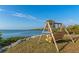 Wooden swing overlooking the calm water at 10428 Marion St, Englewood, FL 34224