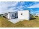 White house with a shed and a paved patio at 1108 43Rd Avenue E Dr, Ellenton, FL 34222