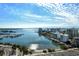 Aerial view showcasing marina, water, and city skyline at 1111 N Gulfstream Ave # 14C, Sarasota, FL 34236