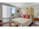 Main bedroom with large window and city view at 1111 N Gulfstream Ave # 14C, Sarasota, FL 34236