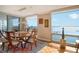 Bright dining room with hardwood floors and water views at 1111 N Gulfstream Ave # 14C, Sarasota, FL 34236