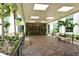 Building entrance with landscaped walkway and seating at 1111 N Gulfstream Ave # 14C, Sarasota, FL 34236