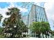 Luxury high-rise building with lush landscaping at 1111 N Gulfstream Ave # 14C, Sarasota, FL 34236