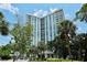 Luxury high rise building with lush landscaping at 1111 N Gulfstream Ave # 14C, Sarasota, FL 34236