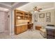 Built-in wooden desk and shelving in home office at 1111 N Gulfstream Ave # 14C, Sarasota, FL 34236