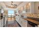 Modern kitchen with granite counters and water views at 1111 N Gulfstream Ave # 14C, Sarasota, FL 34236