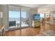 Spacious living area showcasing hardwood floors and stunning water views at 1111 N Gulfstream Ave # 14C, Sarasota, FL 34236