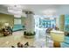 Elegant lobby with seating area and modern chandeliers at 1111 N Gulfstream Ave # 14C, Sarasota, FL 34236