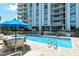 Refreshing pool with patio furniture, inviting residents to relax and enjoy the Florida sunshine at 1111 N Gulfstream Ave # 14C, Sarasota, FL 34236