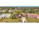 Aerial view of a single Gathering home with a large yard in a residential neighborhood at 121 Van Dyck Dr # Dr, Nokomis, FL 34275