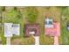 Aerial view of three homes in a neighborhood at 121 Van Dyck Dr # Dr, Nokomis, FL 34275