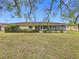 Large backyard with grassy area and partial view of home at 121 Van Dyck Dr # Dr, Nokomis, FL 34275