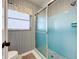 Small bathroom with shower, tile, and window at 121 Van Dyck Dr # Dr, Nokomis, FL 34275