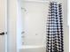 Simple bathroom with a shower/tub combo and a black and white checkered shower curtain at 121 Van Dyck Dr # Dr, Nokomis, FL 34275