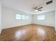 Large bedroom with hardwood floors and ample natural light at 121 Van Dyck Dr, Nokomis, FL 34275