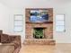 Brick fireplace with a large landscape photograph above the mantle at 121 Van Dyck Dr, Nokomis, FL 34275